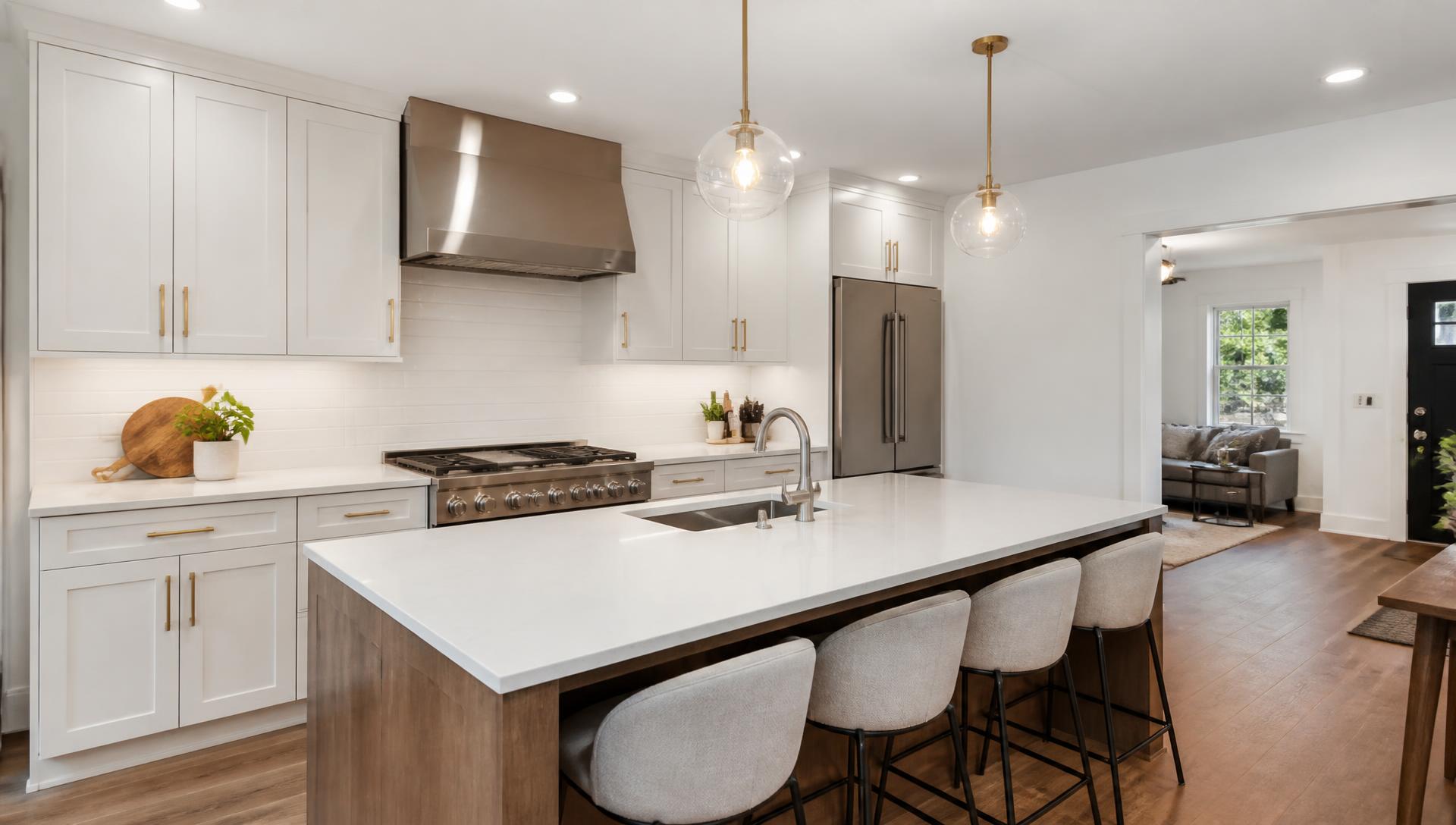 Remodeled kitchen with white cabinetry and quartz counters by a New Jersey property improvement company